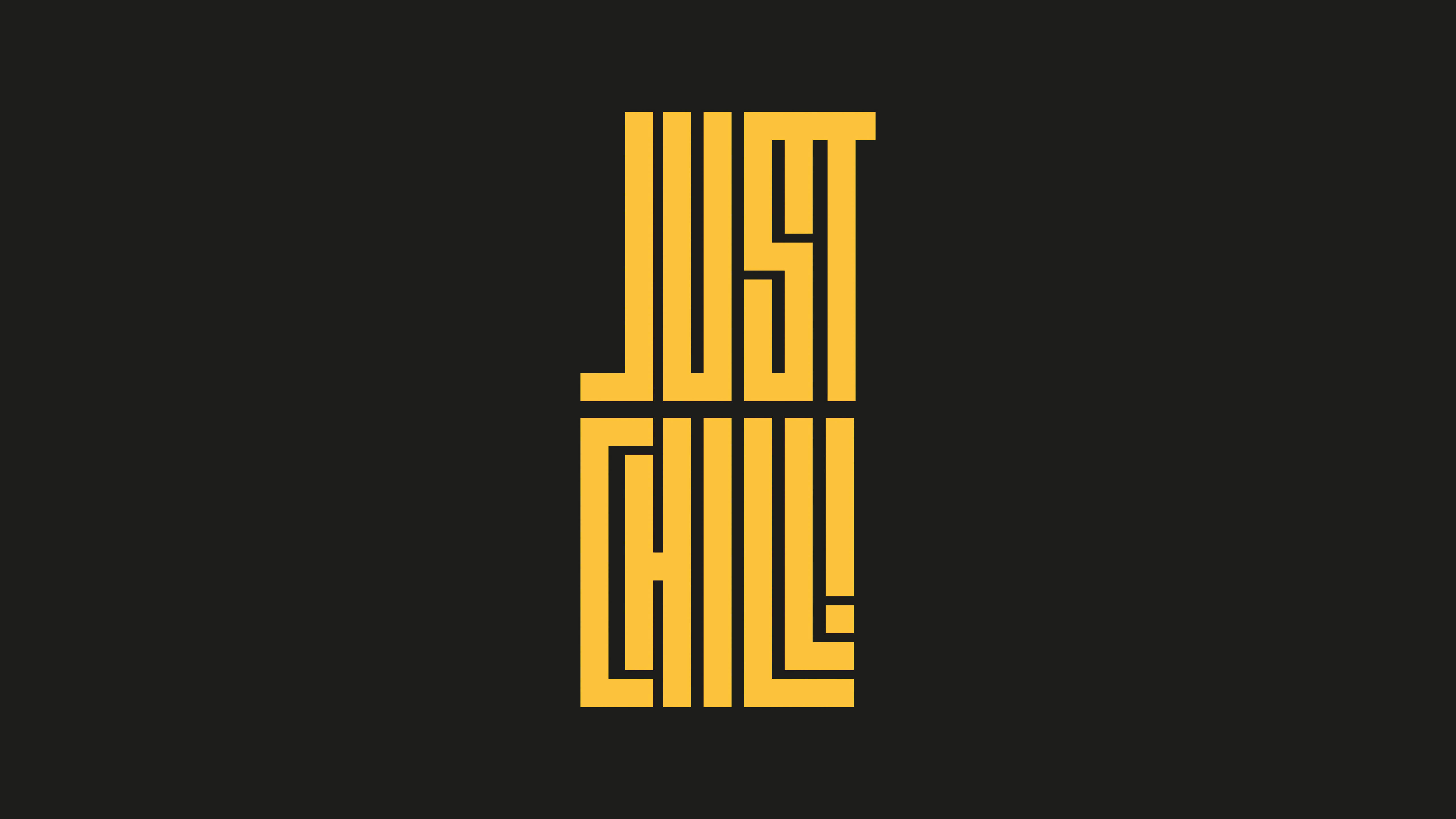 Chill 桌布 壁紙 — 大膽的黃色幾何文字「JUST CHILL」在純黑色背景上脫穎而出。