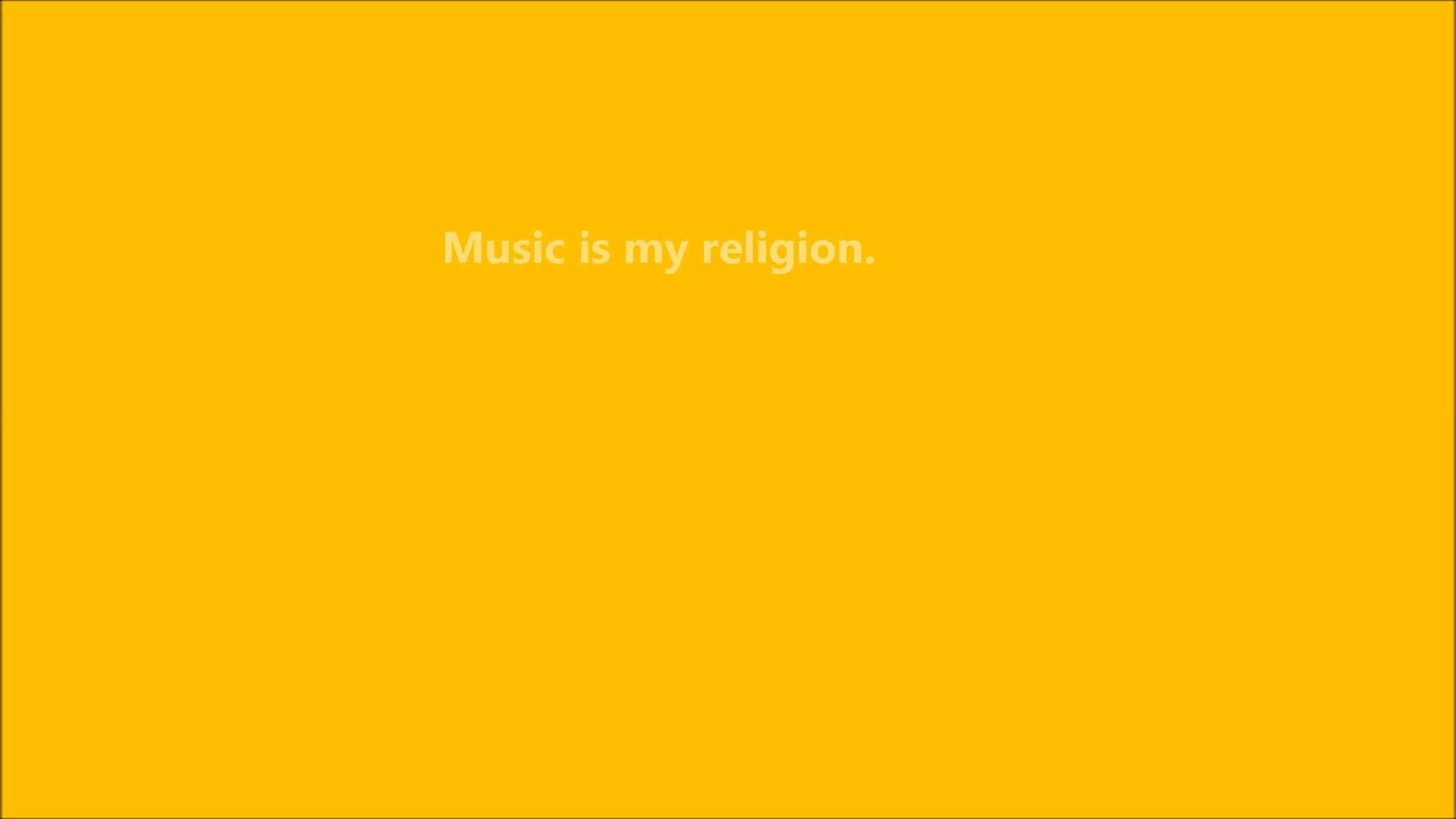 Yellow Aesthetic Computer 桌布 壁紙 — 大膽的黃色背景，中央白色文字宣稱音樂為宗教。