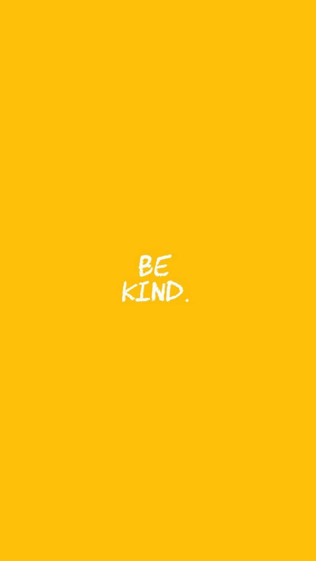 白色 桌布 壁紙 — 大膽的黃色背景上，手寫短語「BE KIND.」以清晰白色文字居中顯示。