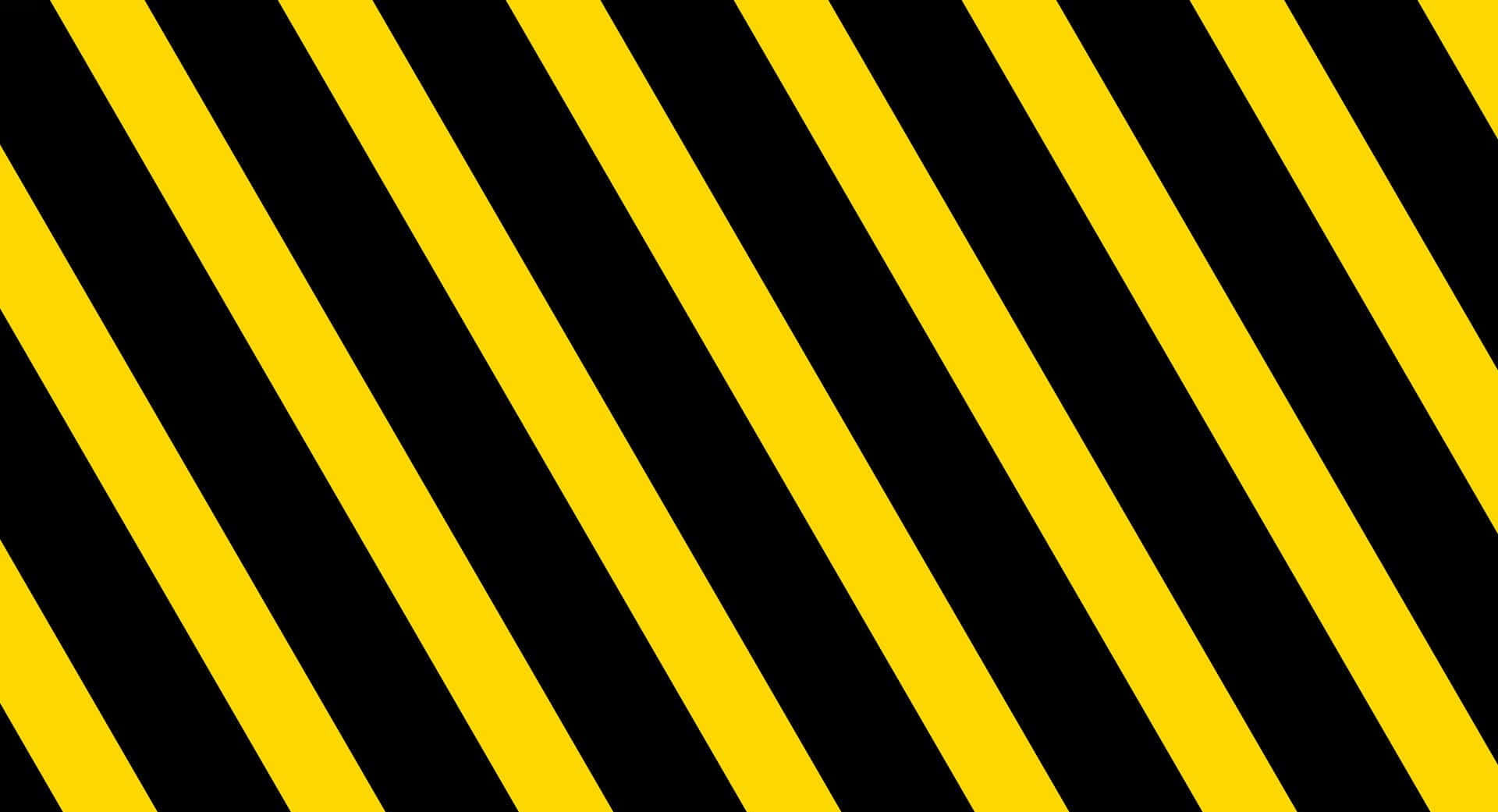 Yellow Striped 桌布 壁紙 — 大膽的黃黑斜紋在整個畫面中營造出高對比度的警告圖案。