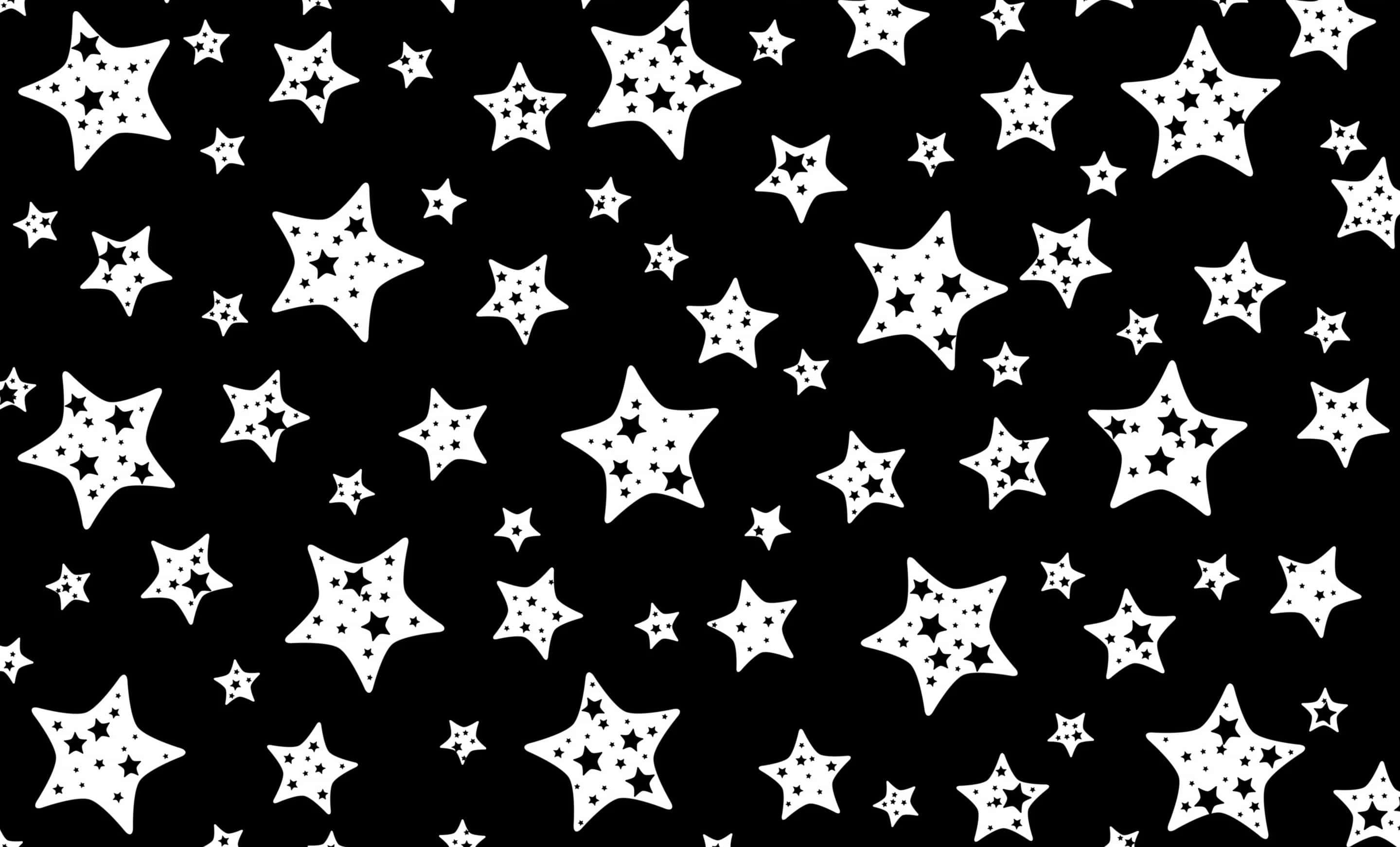 Black And White Star 桌布 壁紙 — 大膽的黑白壁紙，散佈著不同大小的星星形狀，內部帶有星星圖案。