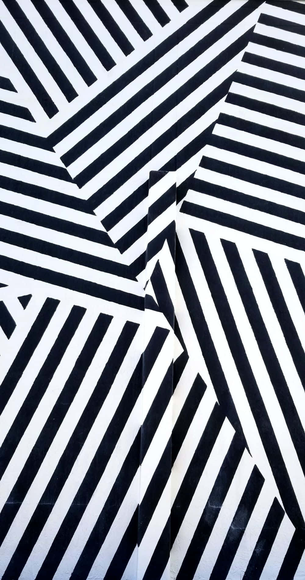 Stripes 桌布 壁紙 — 大膽的黑白對角線條紋營造出具有銳利角度和高對比度的動態幾何圖案。