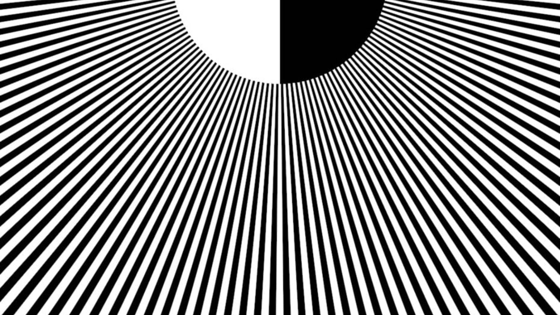 Hypnosis 桌布 壁紙 — 大膽的黑白放射線條向一個分裂的圓圈匯聚，創造出動態的視錯覺。