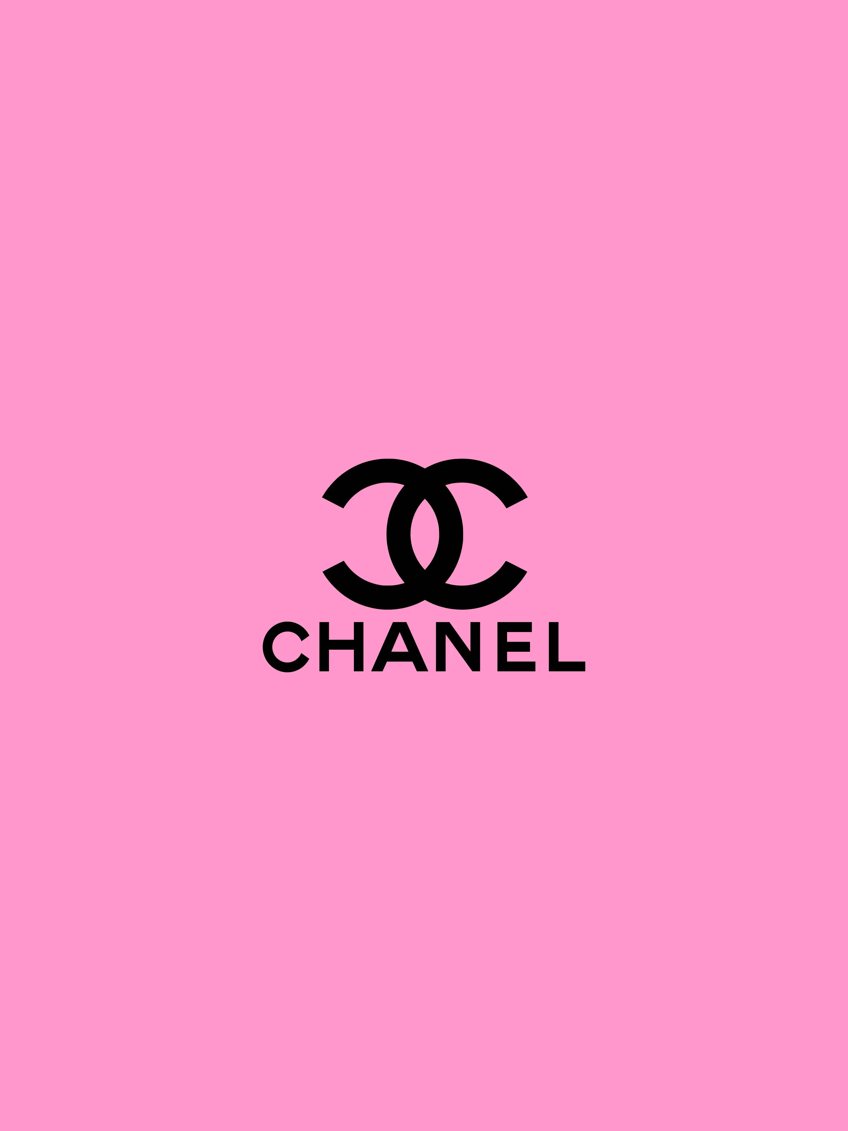 Pink Chanel Logo 桌布 壁紙 — 大膽的黑色 Chanel 標誌居中在純色鮮豔粉紅色背景上。