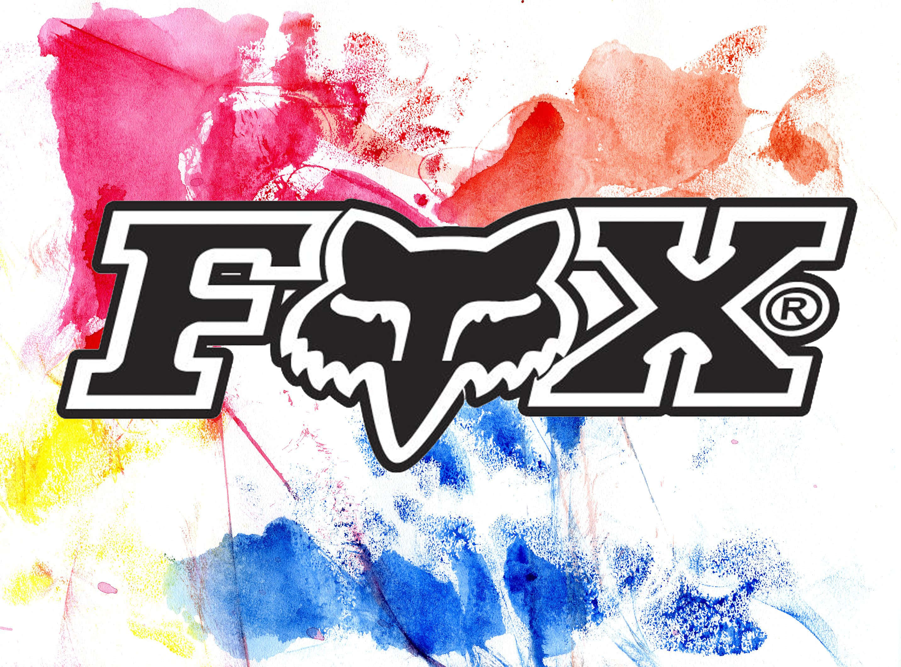Racing 桌布 壁紙 — 大膽的黑色Fox Racing標誌，帶有風格化的狐狸頭，襯以粉紅、紅、黃、藍色的鮮豔抽象水彩潑濺。