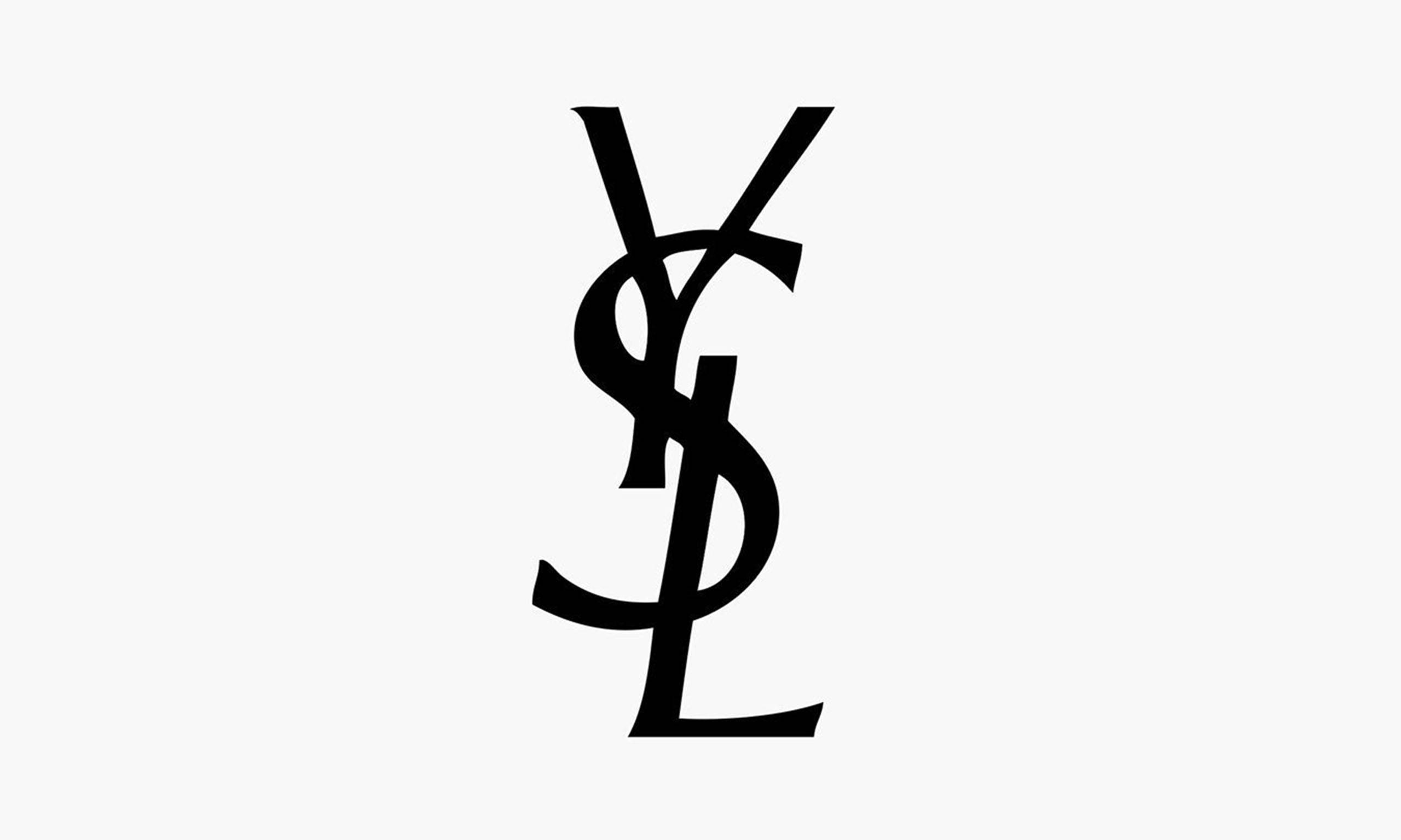 Ysl 桌布 壁紙 — 大膽的黑色YSL字母組合標誌居中於純淺灰色背景上。