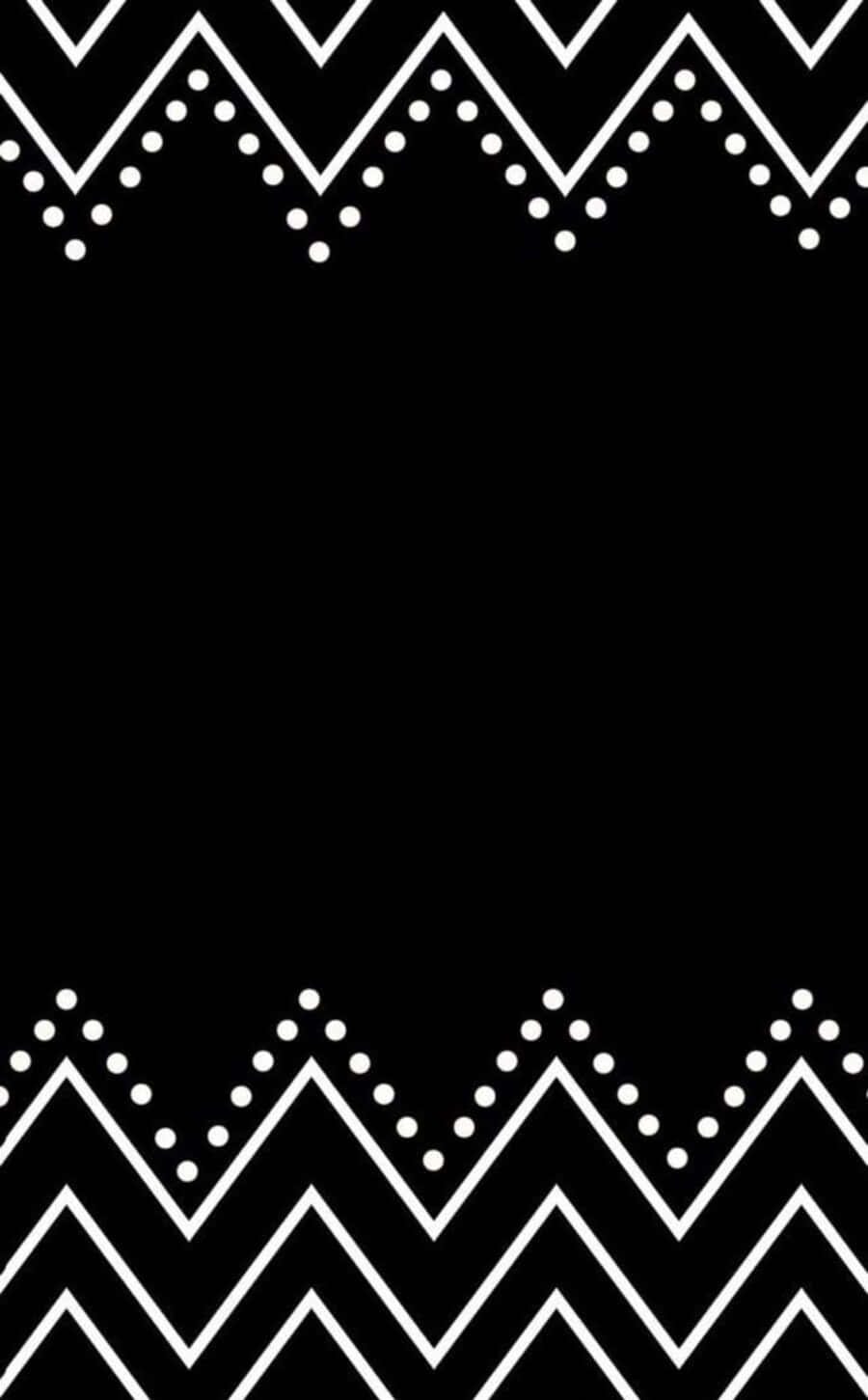 Black And White Dots 桌布 壁紙 — 大膽的黑色背景，頂部和底部飾有白色鋸齒圖案和點狀裝飾。