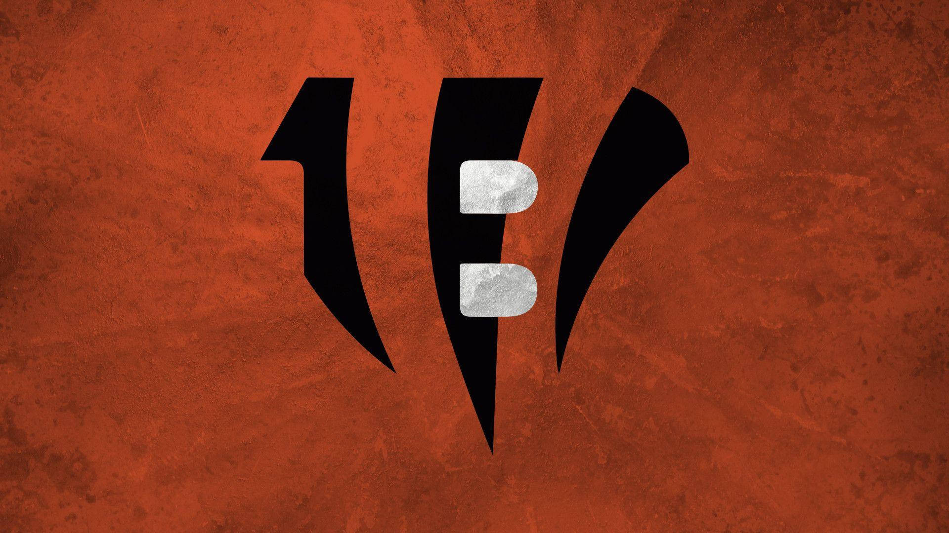 Bengals 標誌在帶紋理的橙色背景上 — 辛辛那提猛虎 壁紙