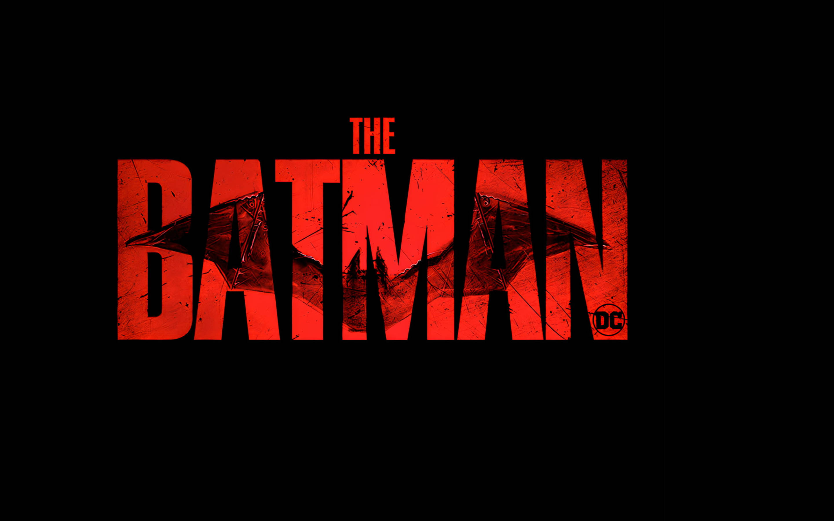 The Batman 桌布 壁紙 — 大膽紅色仿舊「THE BATMAN」標誌，字母內有蝙蝠剪影，襯托純黑背景。