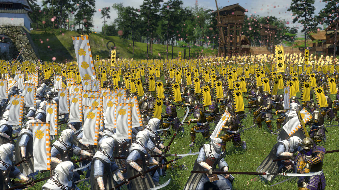 Total War Shogun 2 桌布 壁紙 — 大規模的武士軍隊身穿精細盔甲，在晴朗的天空下穿越陽光照耀的草地。