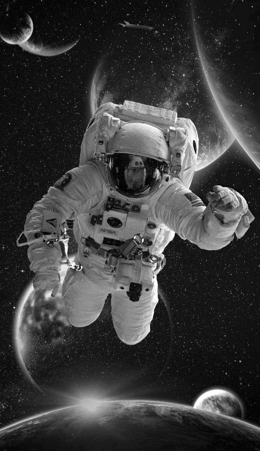 Astronaut iPhone 桌布 壁紙 — 太空人在黑白太空漂浮，身後有行星和星星。