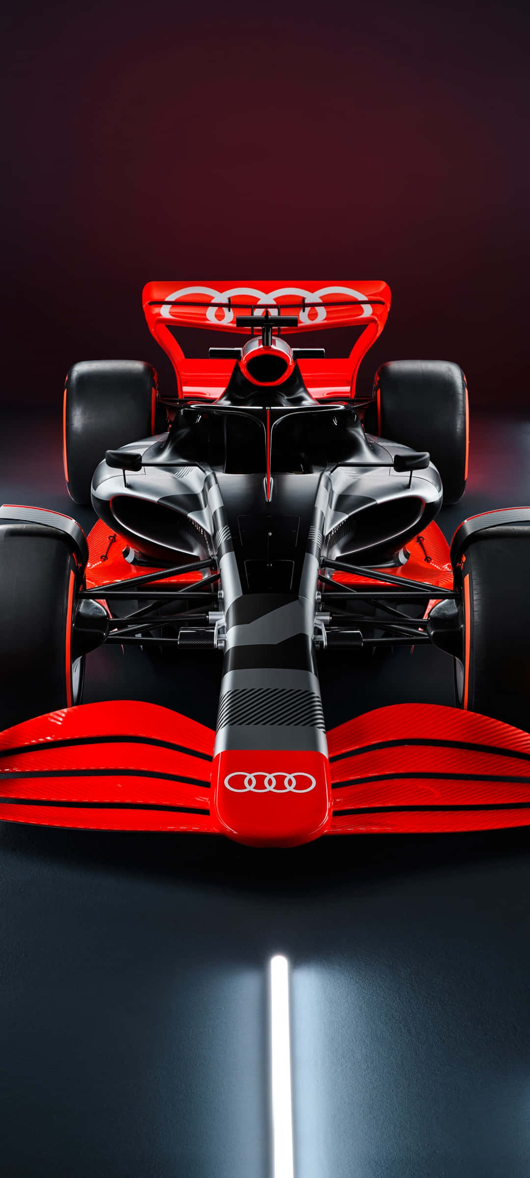 Formula One 桌布 壁紙 — 奧迪F1賽車正面視角，紅色和黑色碳纖維細節在深色工作室背景中發光。