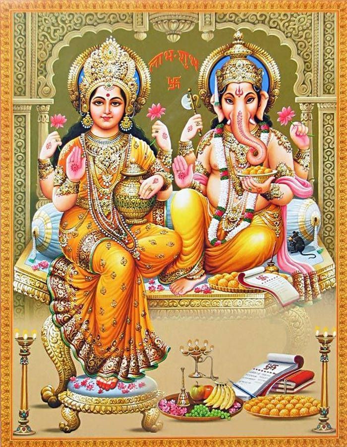 Lakshmi 桌布 壁紙 — 女神拉克什米和象神甘尼許莊嚴地坐在華麗的寶座上，寶座上裝飾著黃金首飾、鮮花和供品。