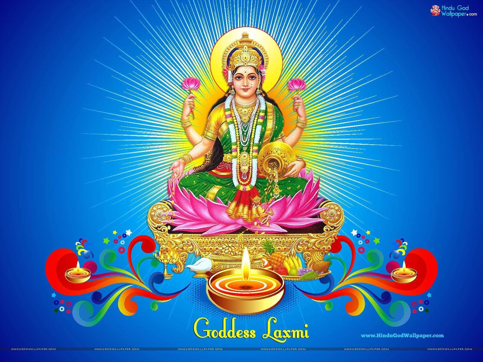 Lakshmi 桌布 壁紙 — 女神拉克什米坐在粉紅色蓮花上，散發神聖優雅，金色光芒從她的光環中迸發，背景為深藍色。