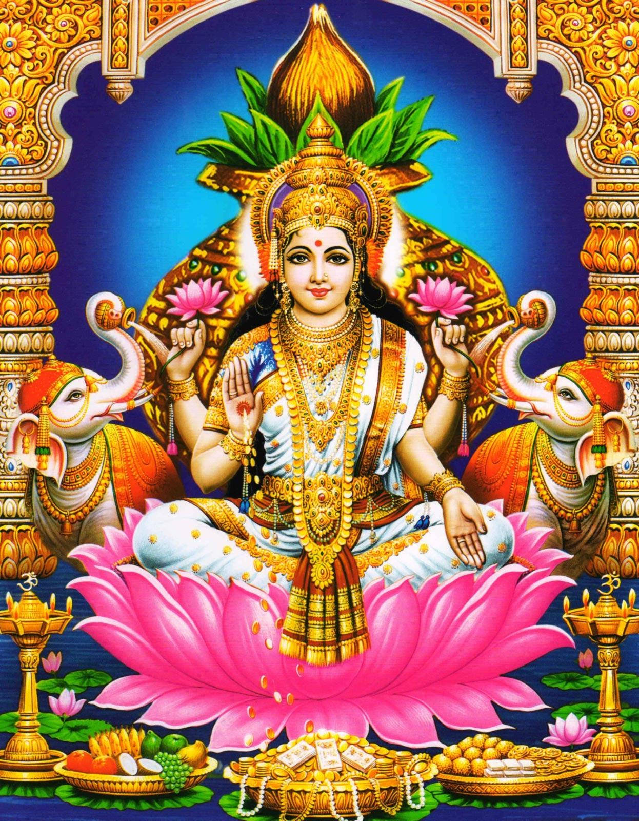 Indian 桌布 壁紙 — 女神拉克什米端坐在巨大的粉紅色蓮花上，兩側有大象，周圍是華麗的金色寺廟建築。