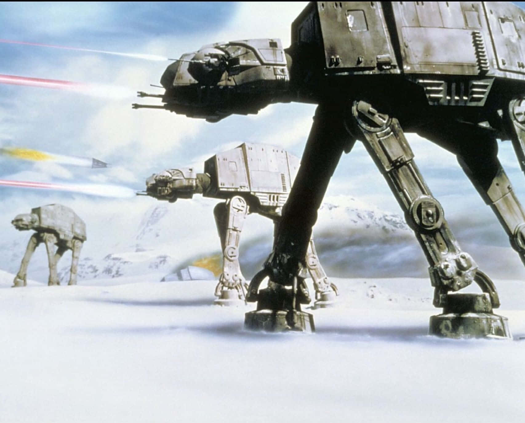 Battle Of Hoth 桌布 壁紙 — 威風凜凜的AT-AT步行機在雪地戰場上闊步前行，雷射光束劃破天際。