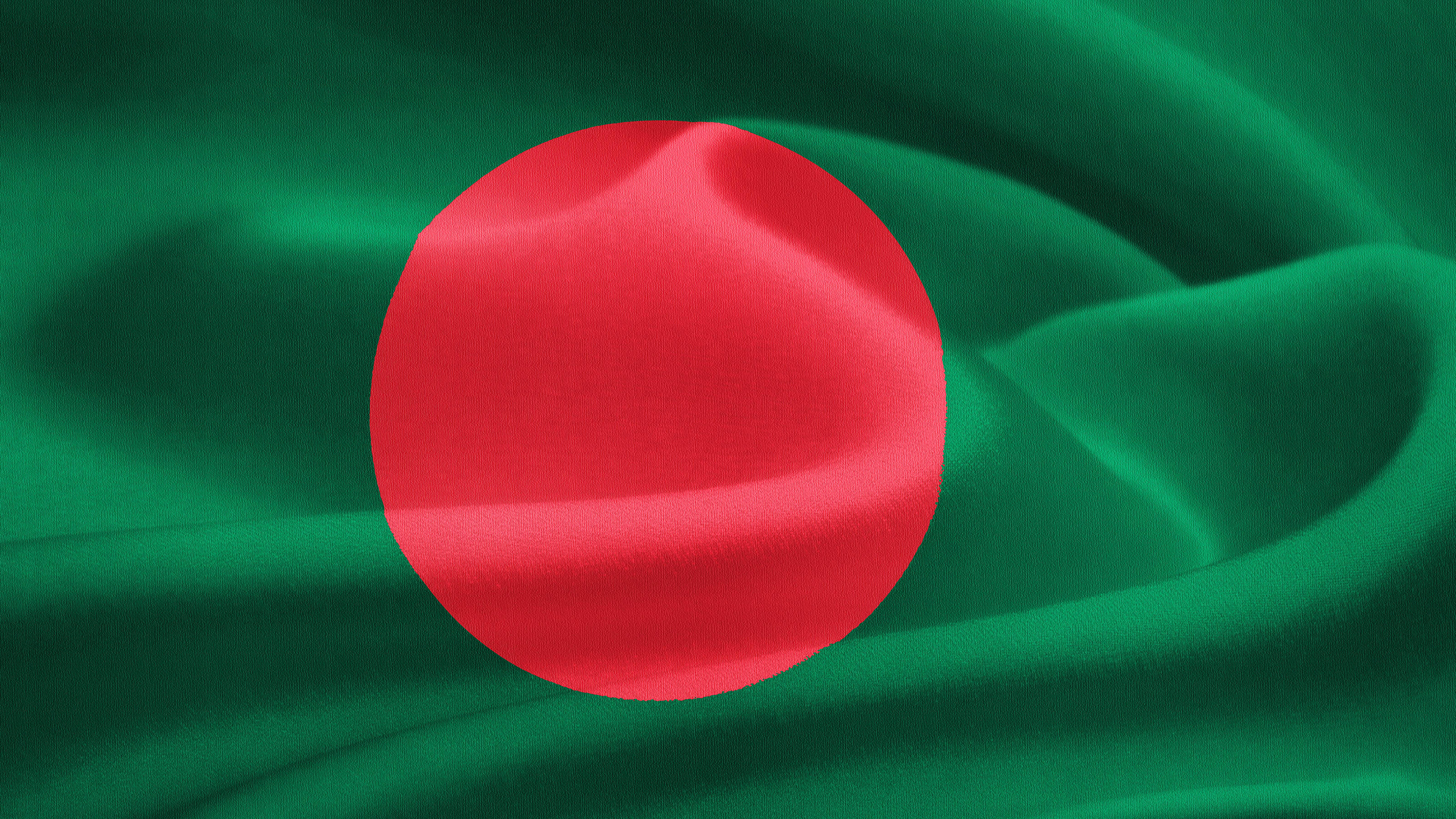 Flag 桌布 壁紙 — 孟加拉國旗特寫，旗幟飄揚，質地濃郁的綠色布料中央有一個鮮豔的紅色圓盤。