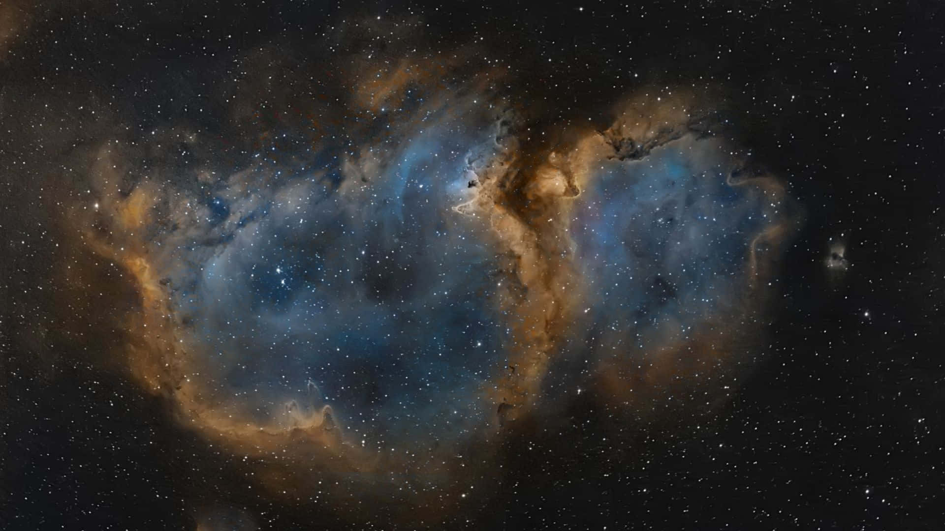 在深空中閃耀著星星的鮮豔藍色和橙色星雲。 — 星雲 GIF 壁紙