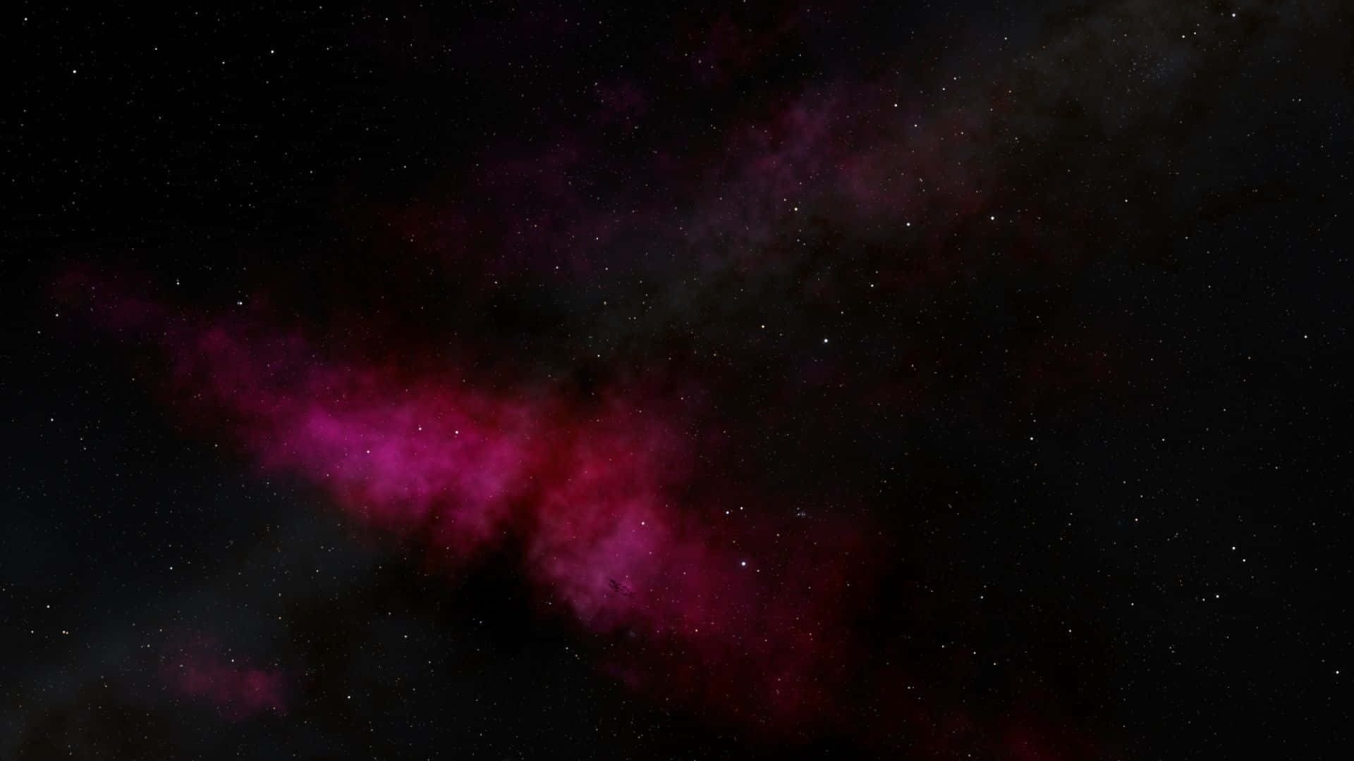 Dark Galaxy 桌布 壁紙 — 宇宙星雲在星空中以鮮豔的洋紅色和深黑色旋轉。