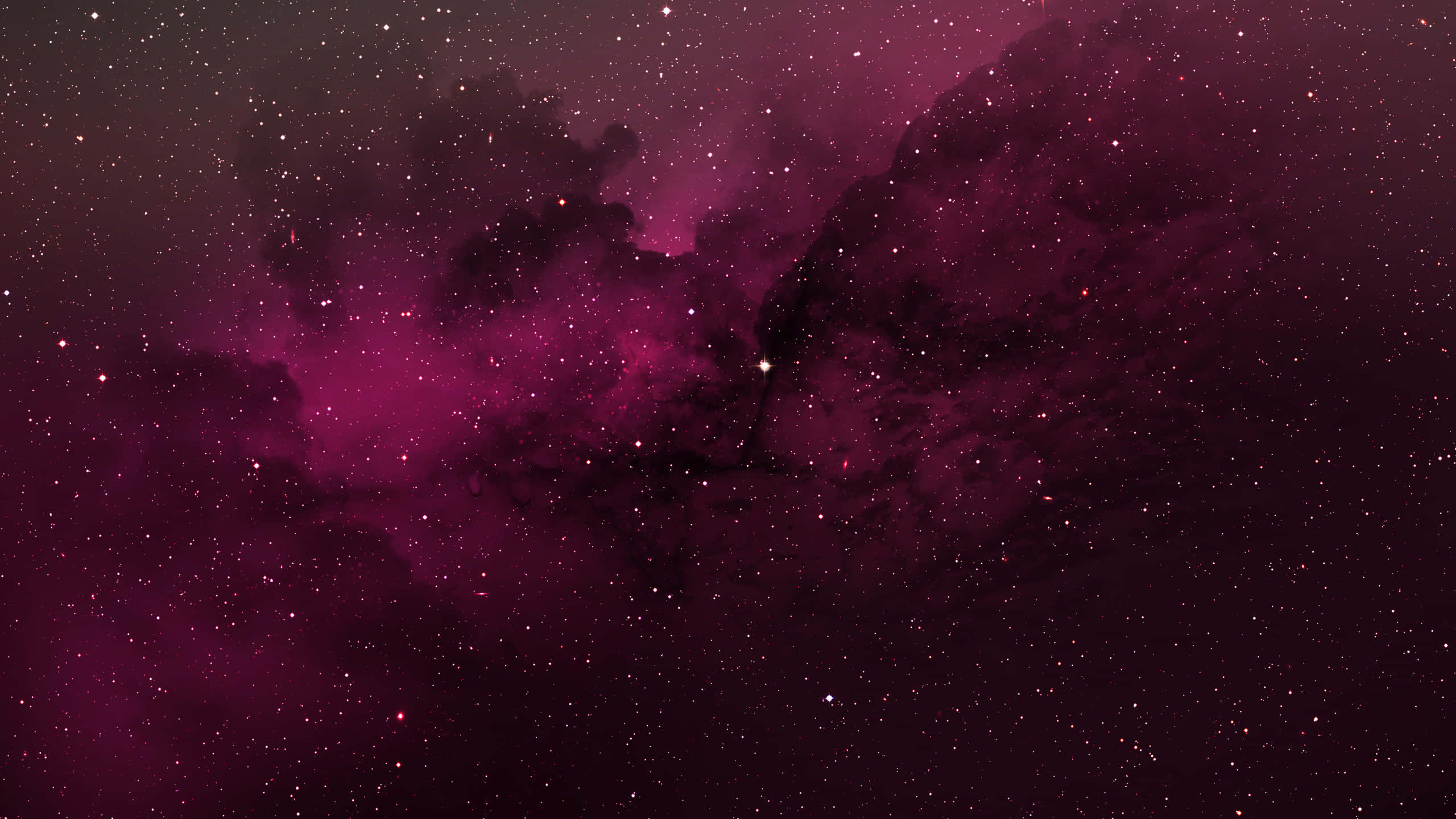紅色動圖 桌布 壁紙 — 宇宙星雲在深洋紅色和黑色中旋轉，散落的星星在虛空中柔和地發光。