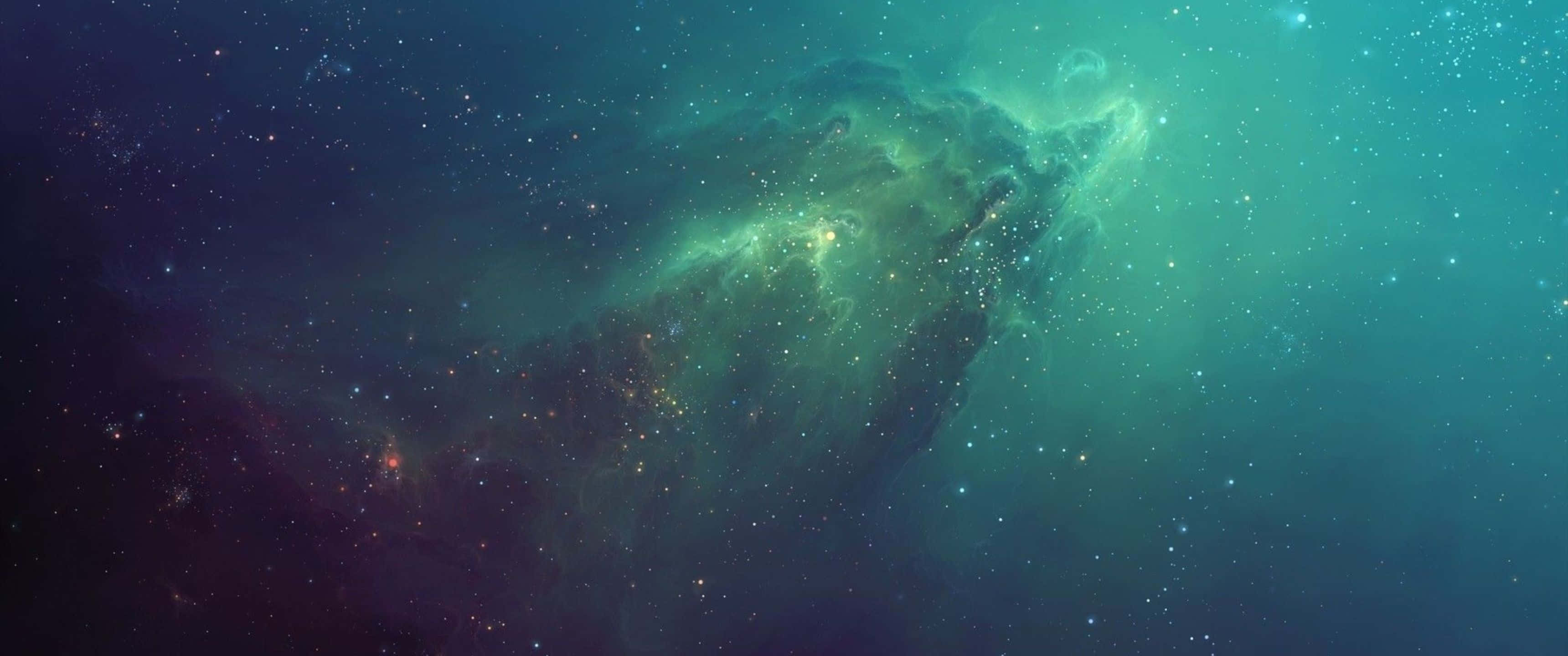 Blue Space 桌布 壁紙 — 宇宙星雲在深空星場中散發出翡翠色和藍綠色的光芒。