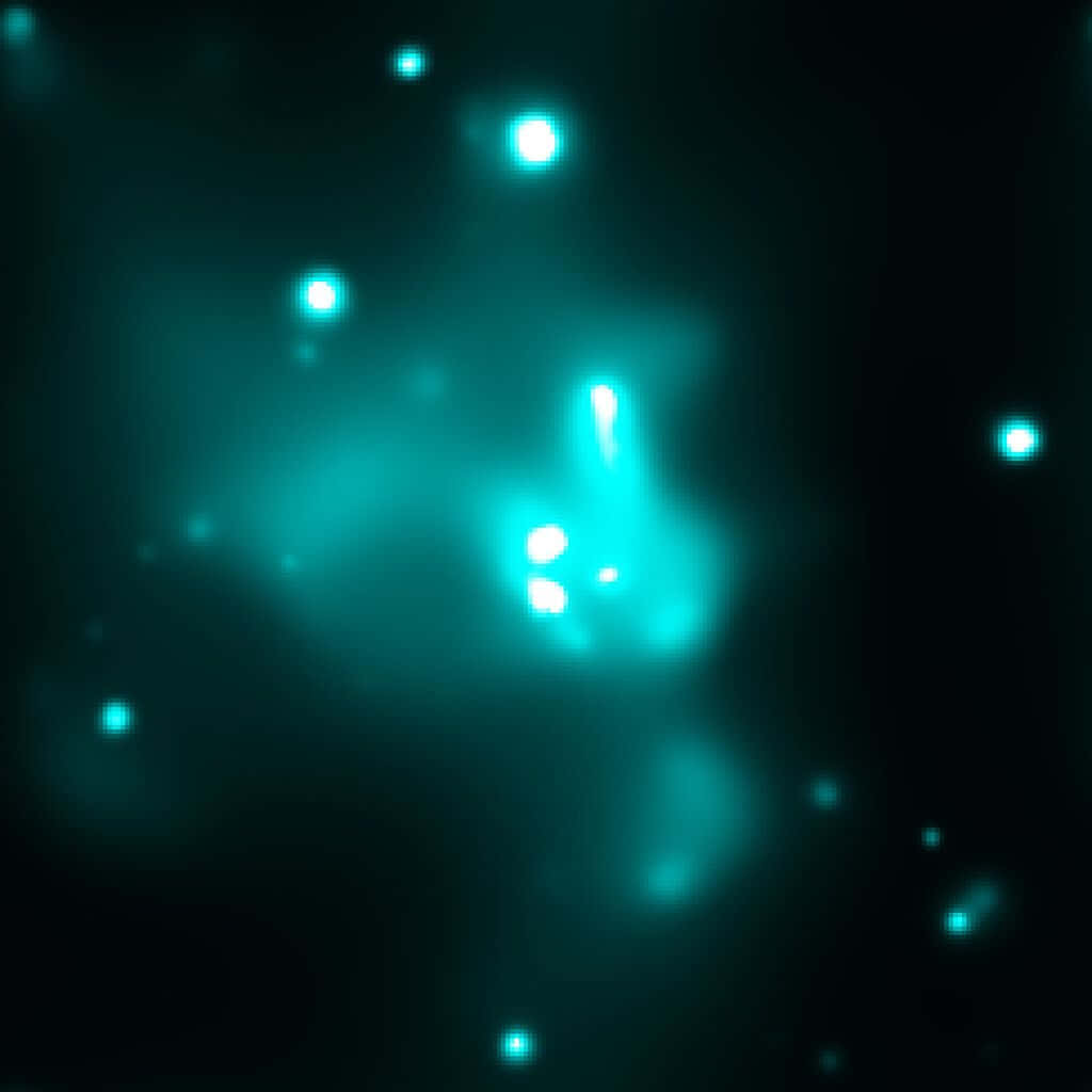 Galactic Center 桌布 壁紙 — 宇宙星雲在黑暗虛空中散發鮮豔的青綠色光芒，周圍散佈著發光球體。
