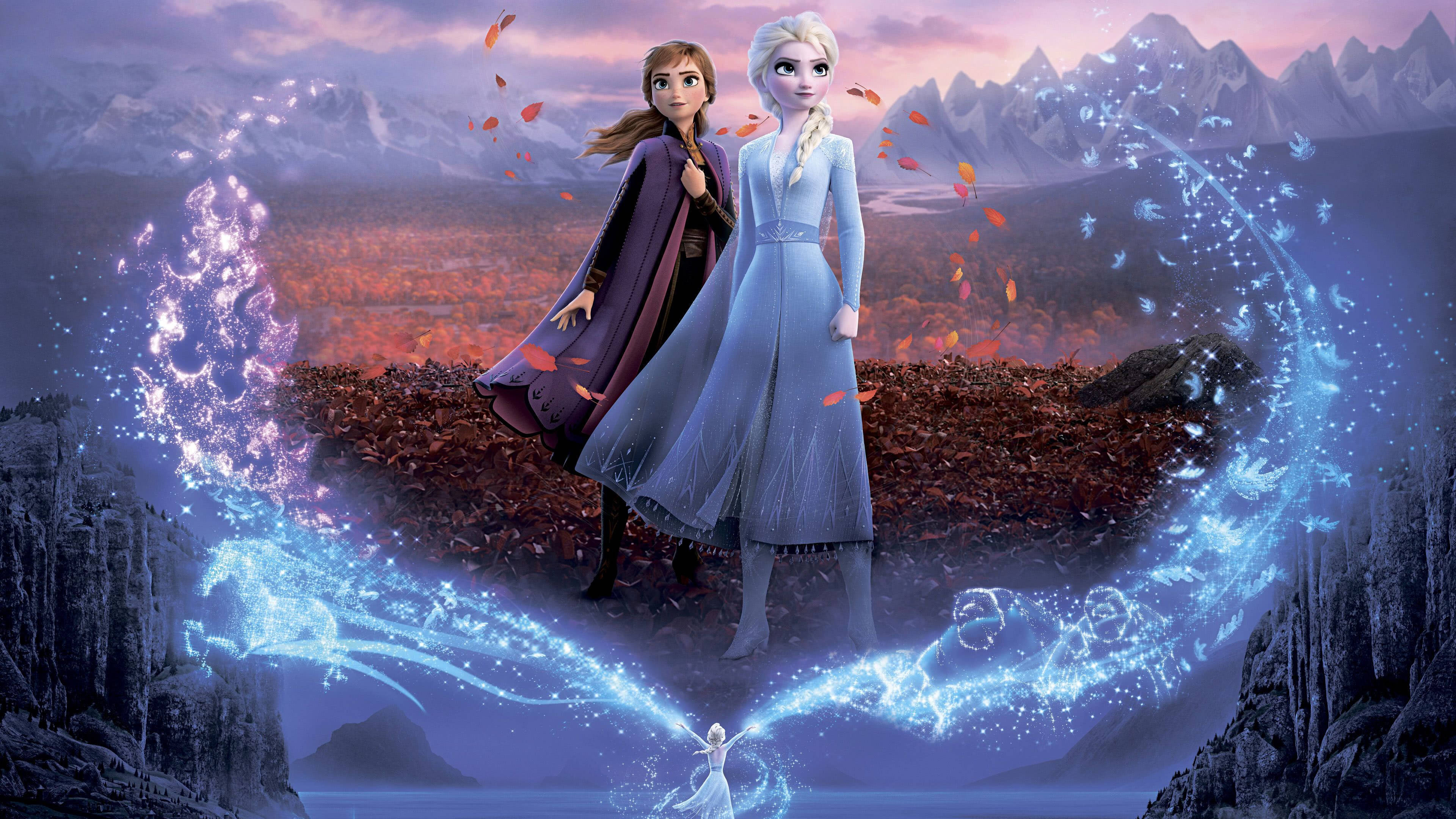 冰雪奇緣2 桌布 壁紙 — 安娜和艾莎站在白雪覆蓋的懸崖上，魔法冰痕在她們周圍旋轉，背景是暮色中的山脈。