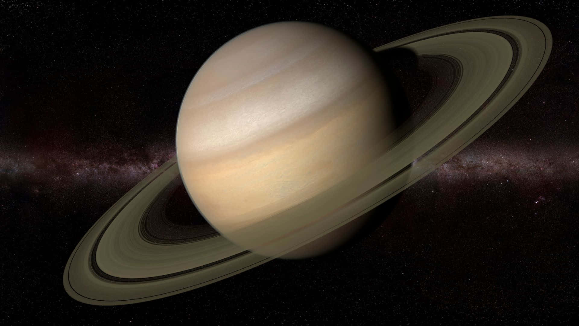 行星動畫 桌布 壁紙 — 宏偉的土星及其標誌性光環在繁星點點的宇宙背景和微弱的星雲中柔和地發光。