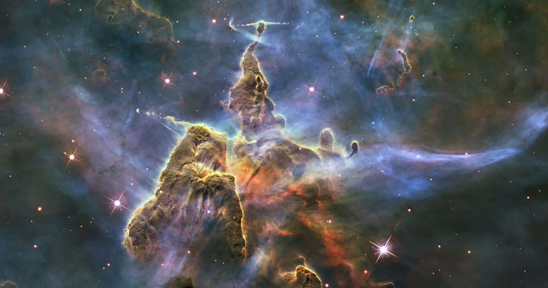 桌布 壁紙 — 宏偉的宇宙氣體和塵埃柱，由新生恆星在充滿活力的星雲中照亮。