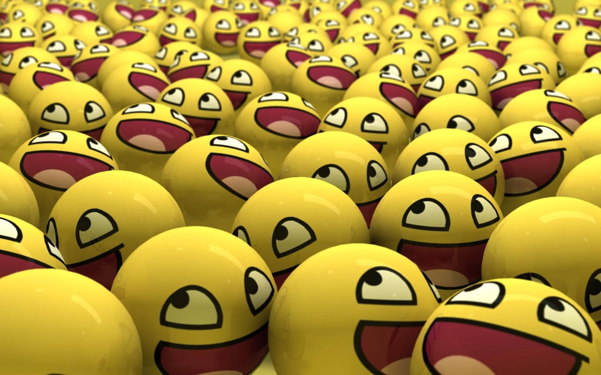 faces 桌布 壁紙 — 密集的光澤黃色表情符號球，有寬闊的咧嘴笑嘴和卡通眼睛。