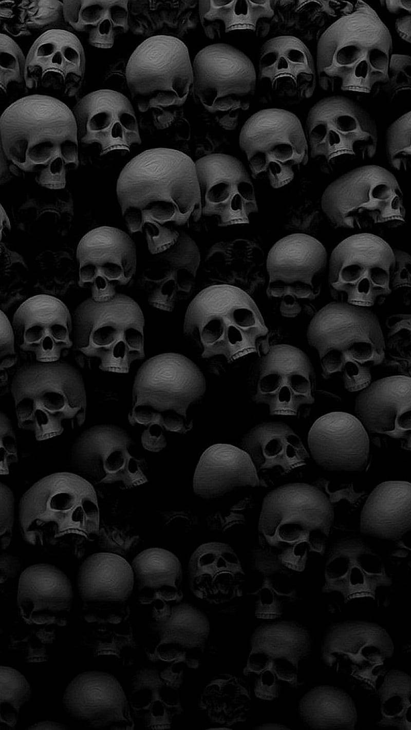 bones 桌布 壁紙 — 密集的單色骷髏圖案填滿了黑暗、不祥的桌布框架。