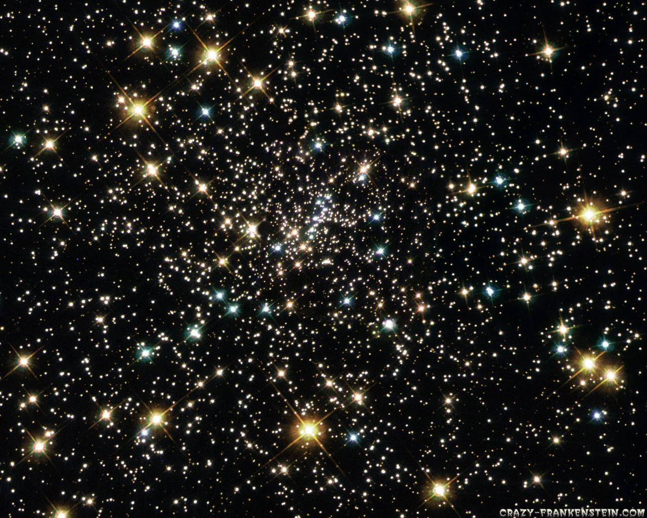 星星動圖 桌布 壁紙 — 密集的星團在漆黑的太空虛空中閃爍，帶有金色和青色的亮點。