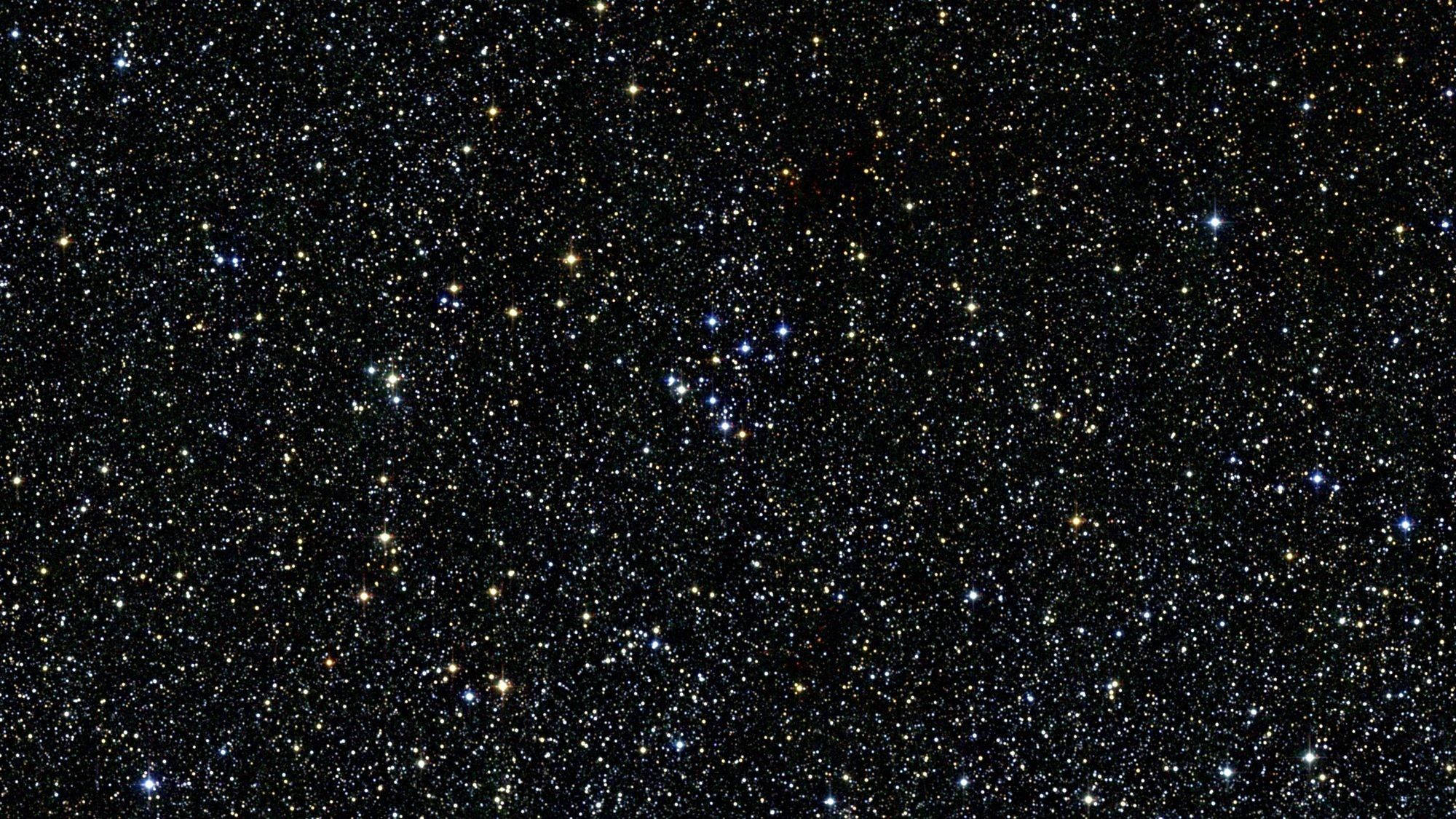 Star Space 桌布 壁紙 — 密集的星場在深邃的太空黑暗中閃爍，顯露出無數色彩鮮豔的光點。