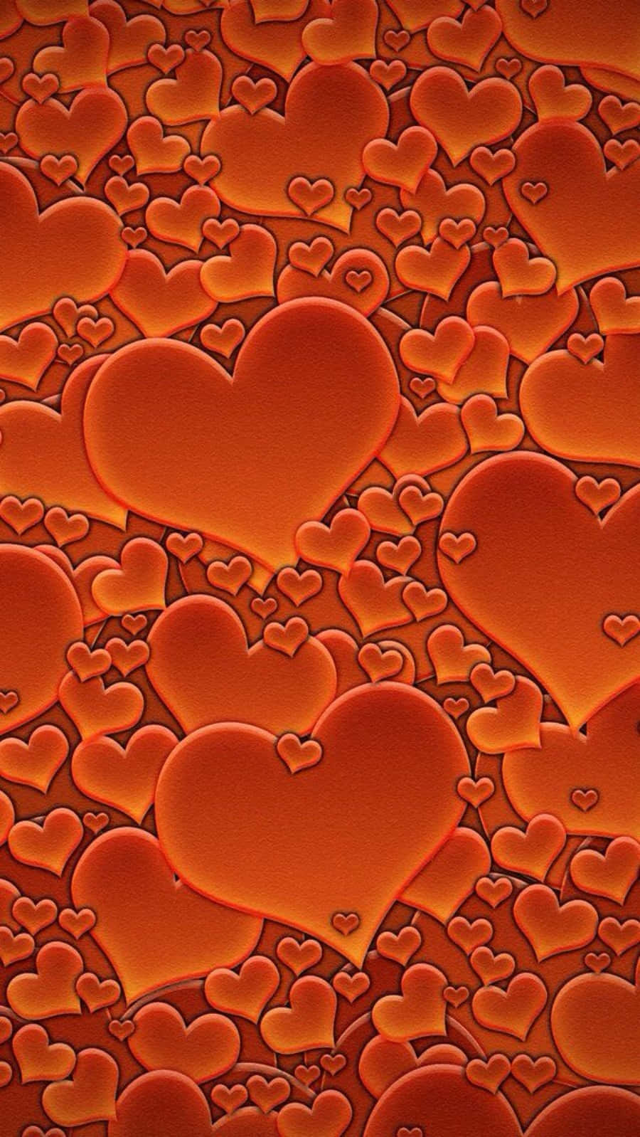 Orange Heart 桌布 壁紙 — 密集的發光橙色心形圖案，大小不一，營造出溫暖浪漫的質感。