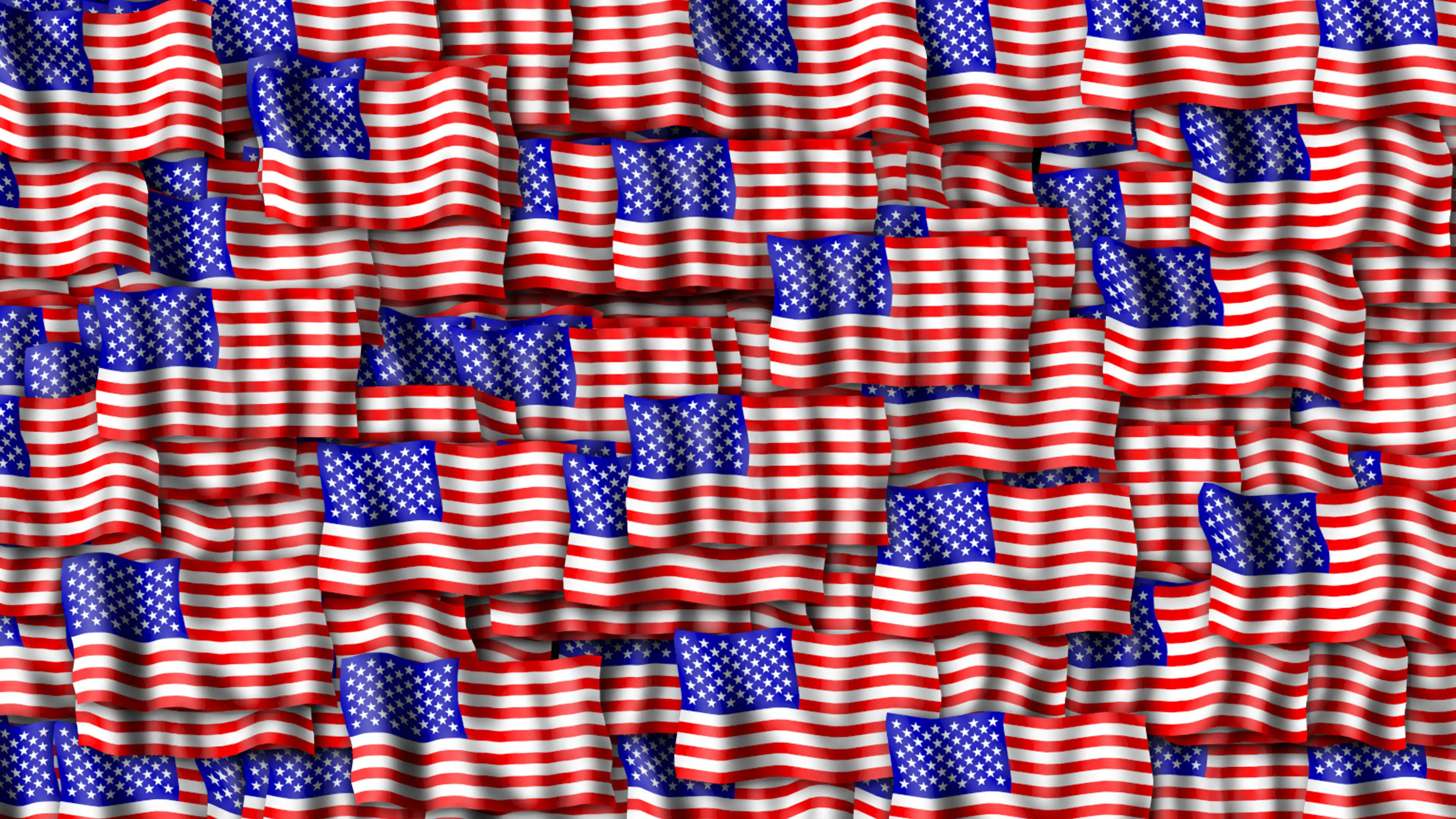 Flag 桌布 壁紙 — 密集的美國國旗飄揚形成一個大膽的愛國圖案，有紅、白、藍色條紋。