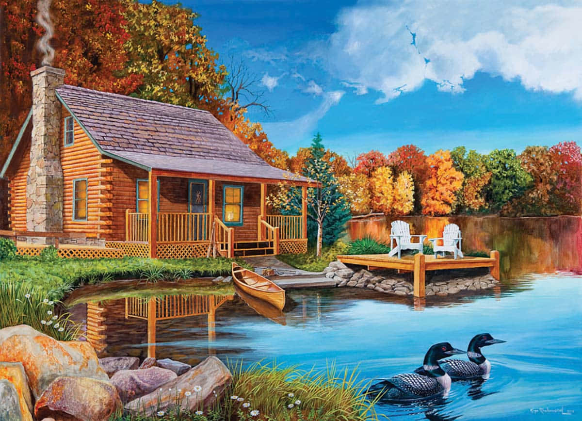 Fall Cabin 桌布 壁紙 — 寧靜湖邊的舒適木屋，周圍環繞著秋葉，附近有潛鳥游泳。