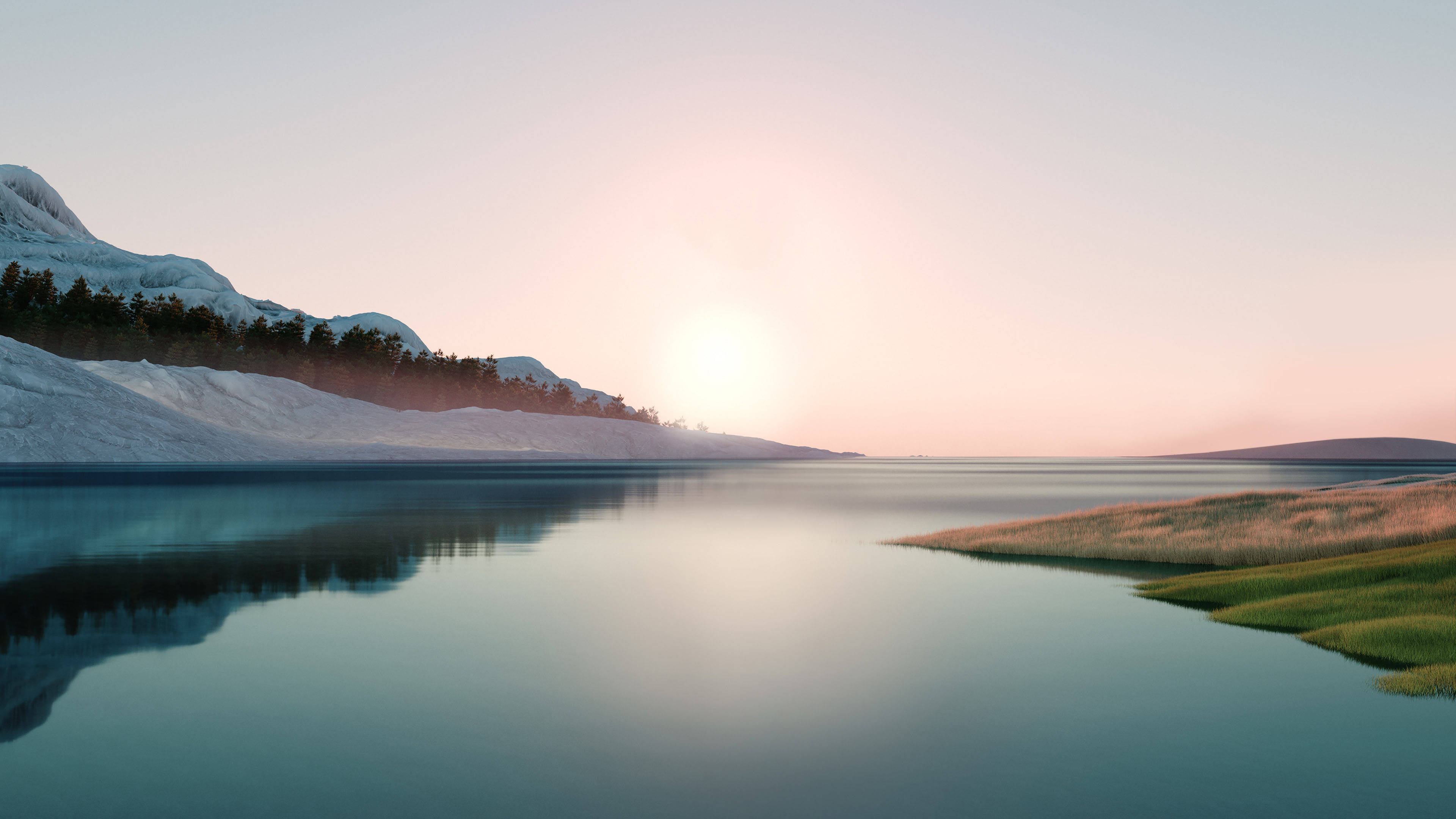 Windows 11 桌布 壁紙 — 寧靜的冬日湖泊映照著柔和的粉紅色日出，背景是積雪的山脈和常綠樹。