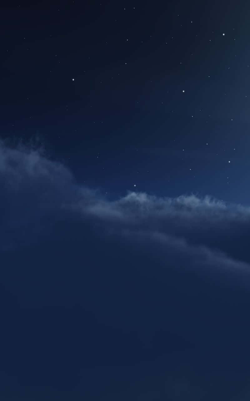 有星星和雲的夜空 — 直式 GIF 壁紙