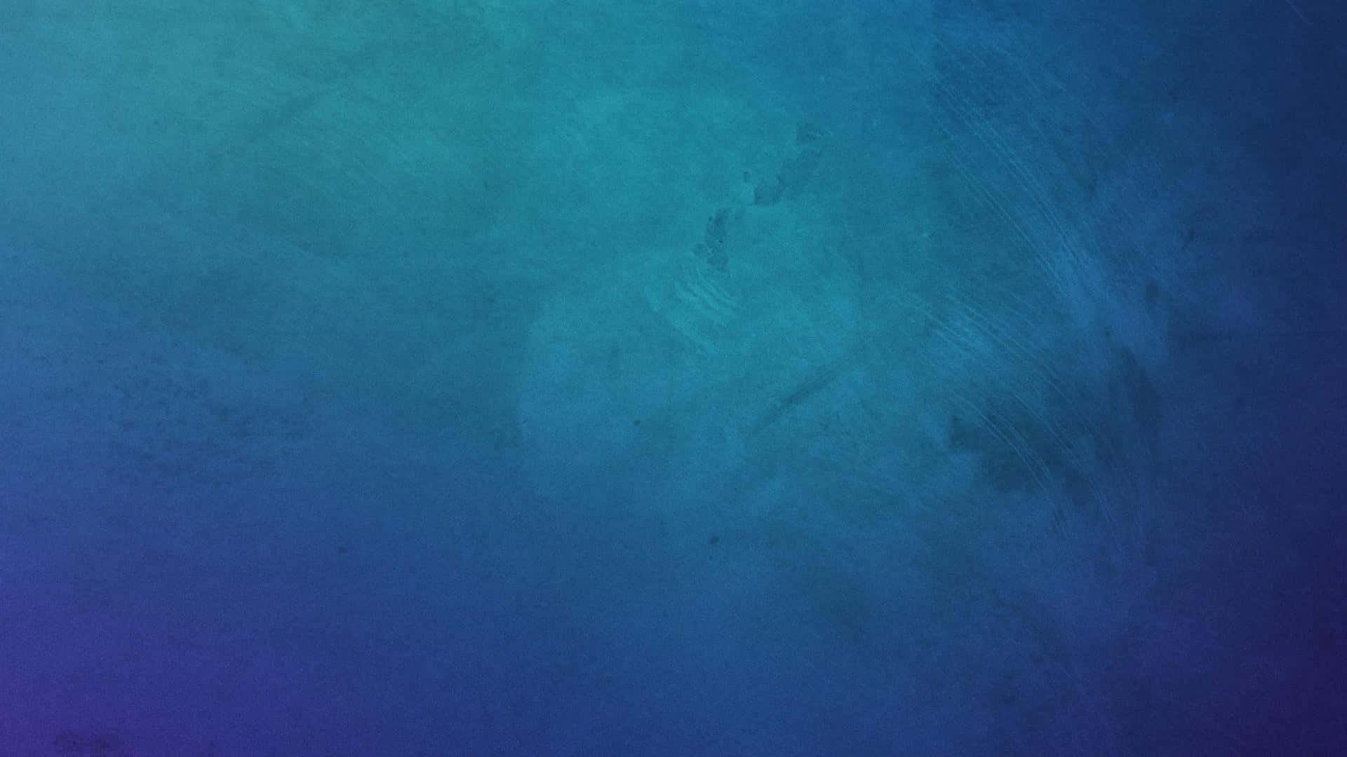 簡單動圖 桌布 壁紙 — 寧靜的水下場景，帶有漸變藍色和微妙的紋理，暗示深度和寧靜。