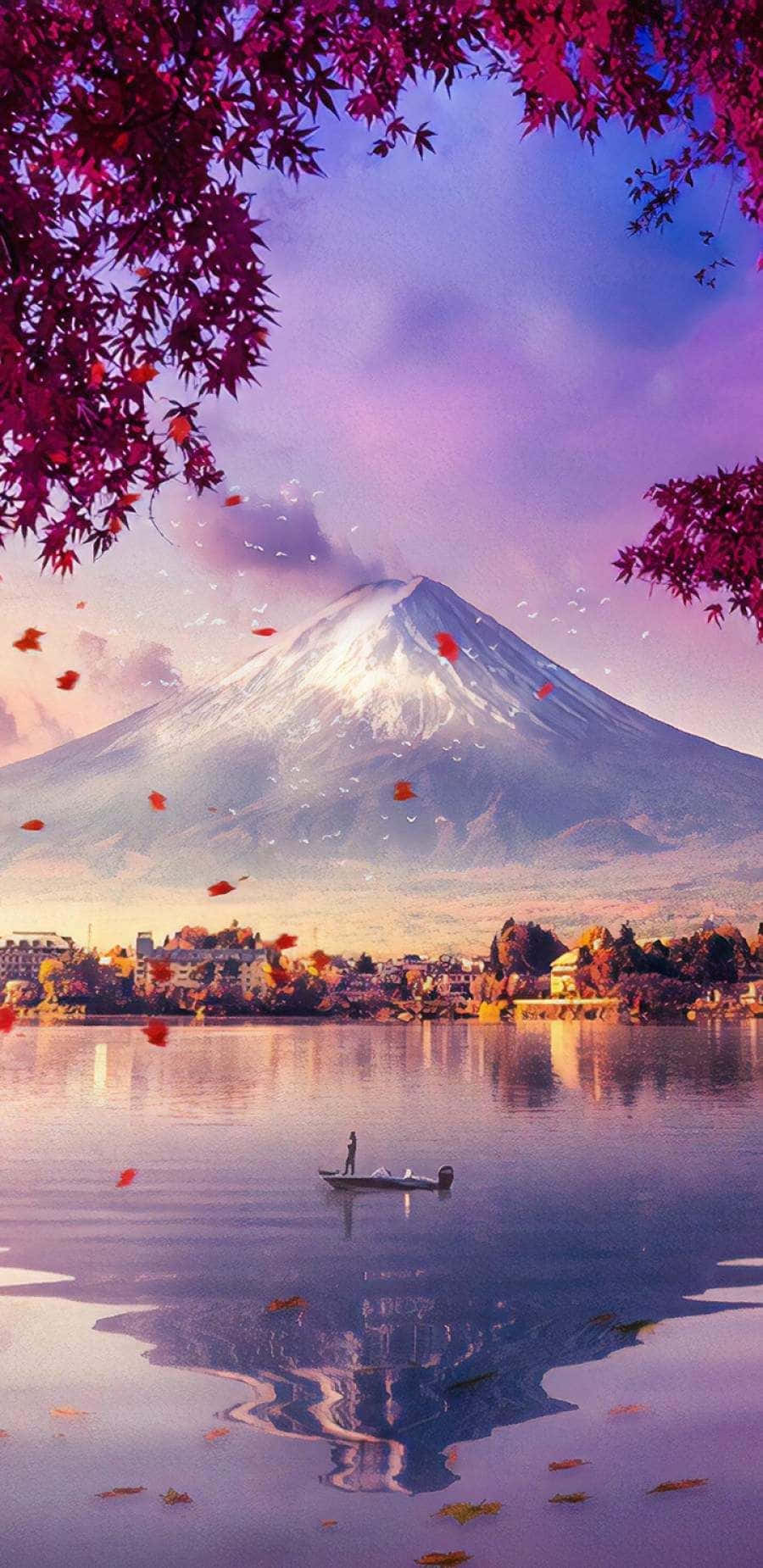 日本 桌布 壁紙 — 寧靜的湖面倒映著白雪覆蓋的富士山，周圍環繞著在暮色中飄揚的鮮豔粉紅楓葉。