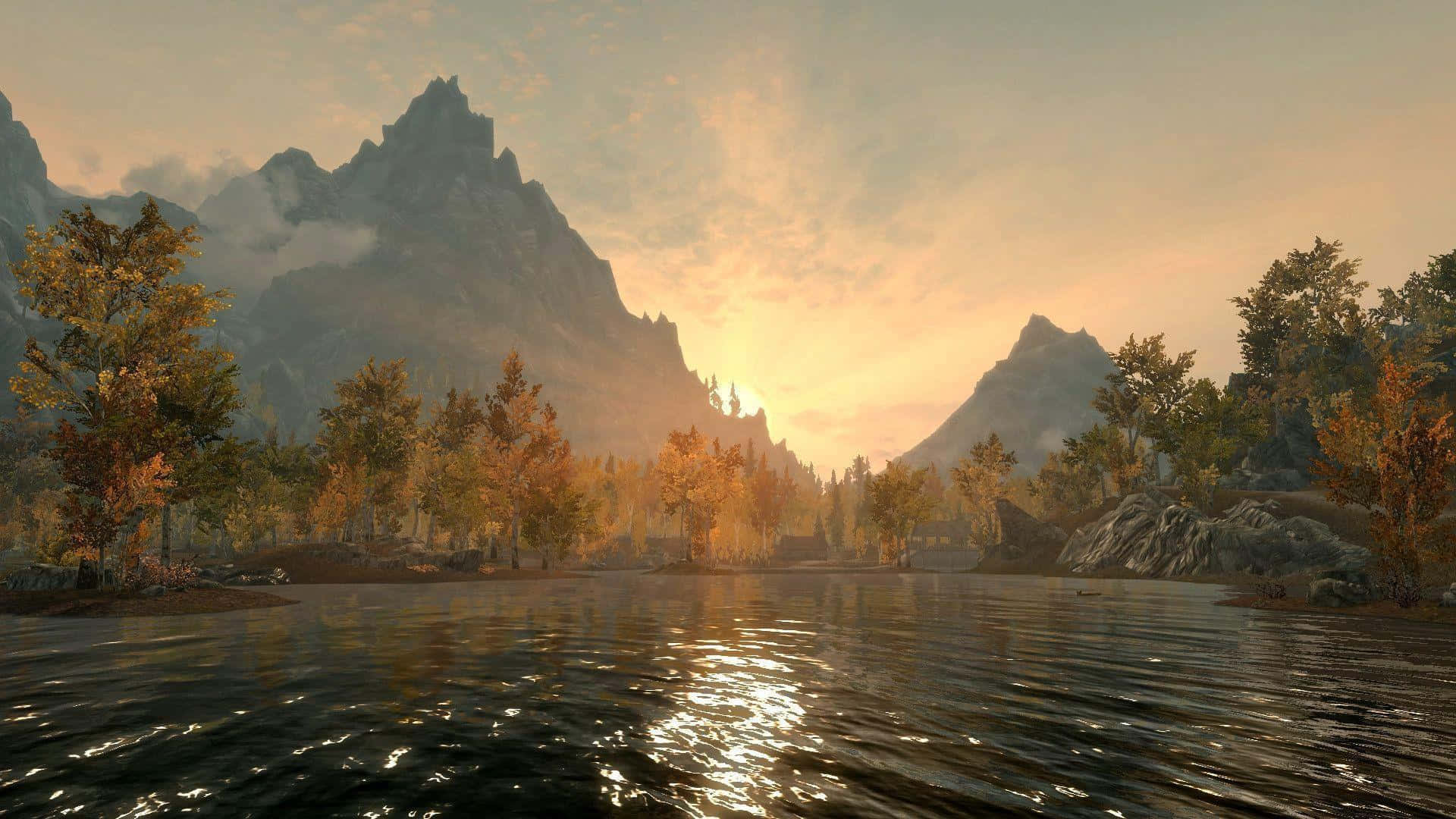 Skyrim Landscapes 桌布 壁紙 — 寧靜的湖面倒映著金色的夕陽，秋樹與崎嶇的山脈環繞著這片恬靜的景色。