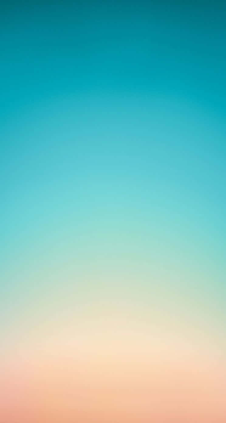 iPhone 5c 桌布 壁紙 — 寧靜的漸層天空，從藍綠色過渡到地平線上的柔和蜜桃色。