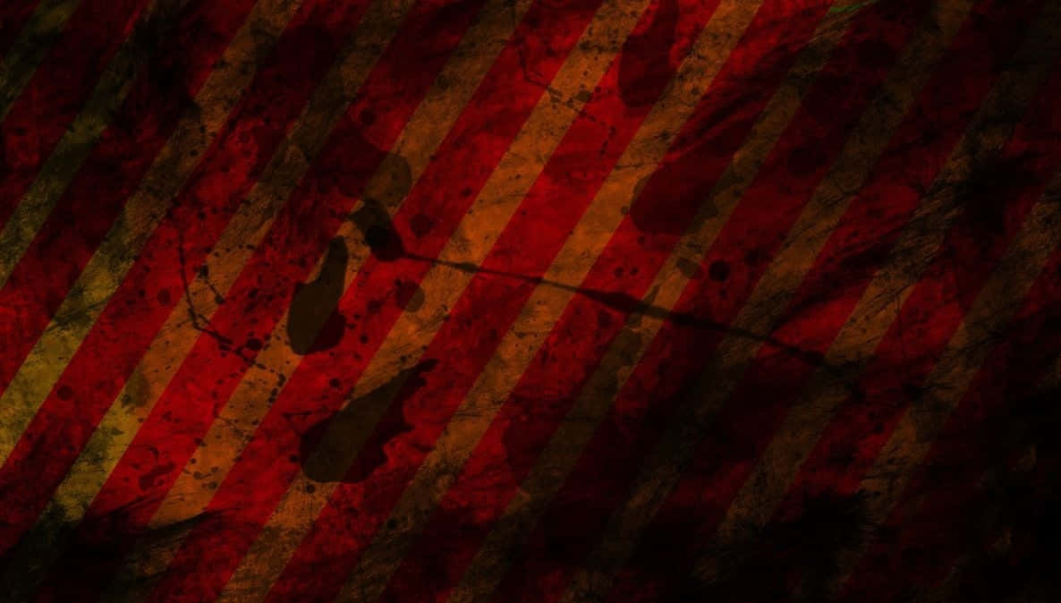 Red Grunge 桌布 壁紙 — 對角線的紅色和橙色條紋，帶有頹廢質感和深色飛濺，營造出粗糙的警告背景。