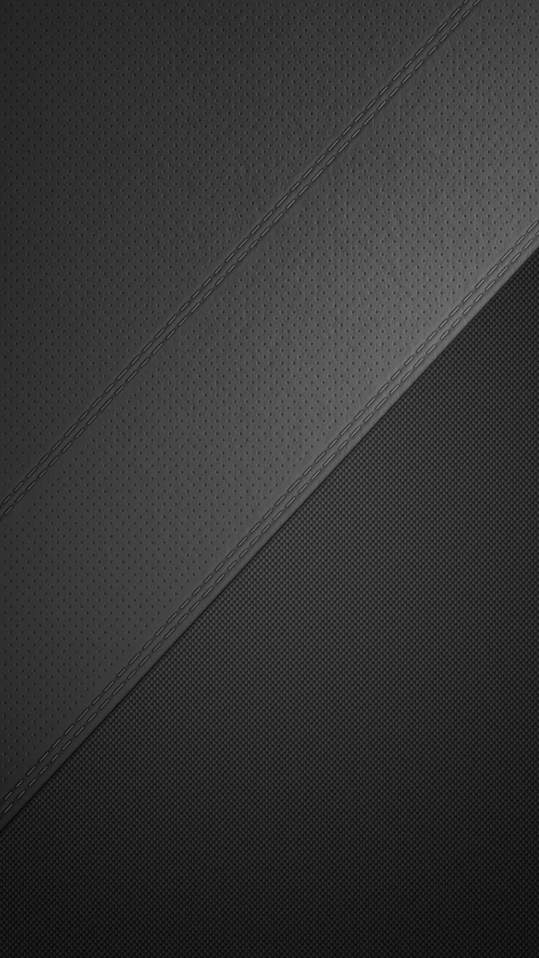 texture 桌布 壁紙 — 對角縫線黑色皮革面板，帶有紋理表面和微妙的漸變照明。