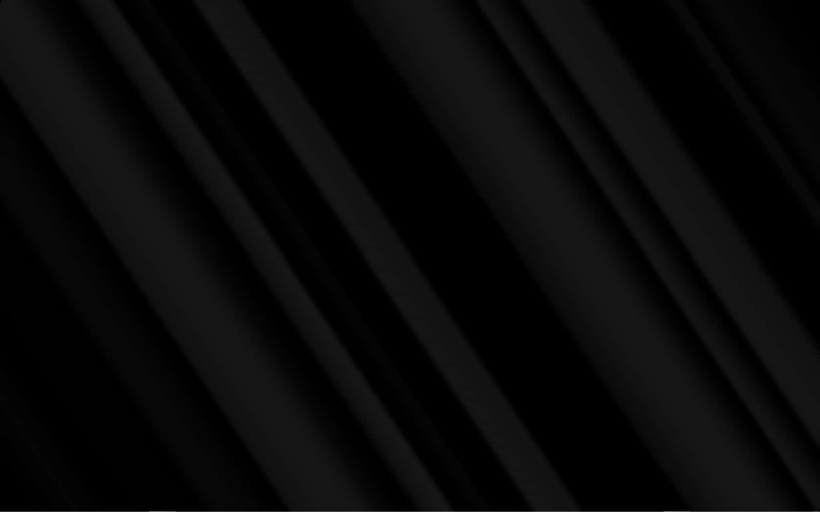 Plain Black Desktop 桌布 壁紙 — 對角黑色布料摺疊營造出簡約時尚的質感，帶有微妙的漸變陰影。