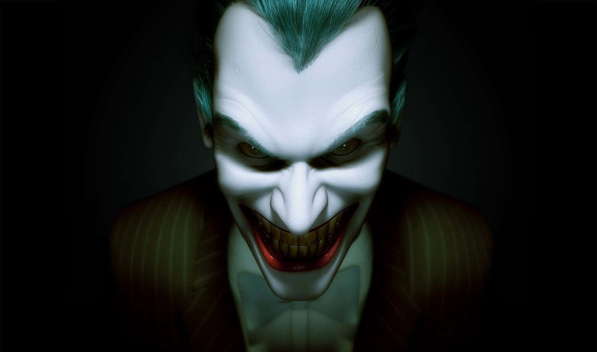 Evil Joker 桌布 壁紙 — 小丑的近距離特寫，蒼白的妝容、綠色的頭髮，在黑暗的背景下露出邪惡的笑容。