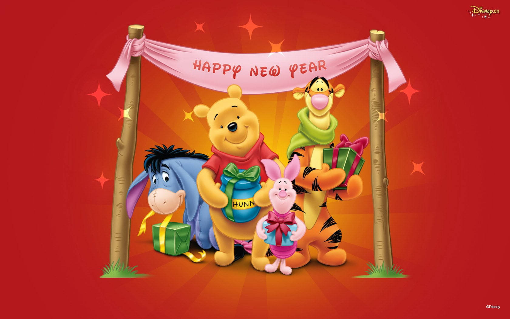 小熊維尼和朋友們在新年橫幅下拿著禮物。 — Winnie the pooh GIF 壁紙