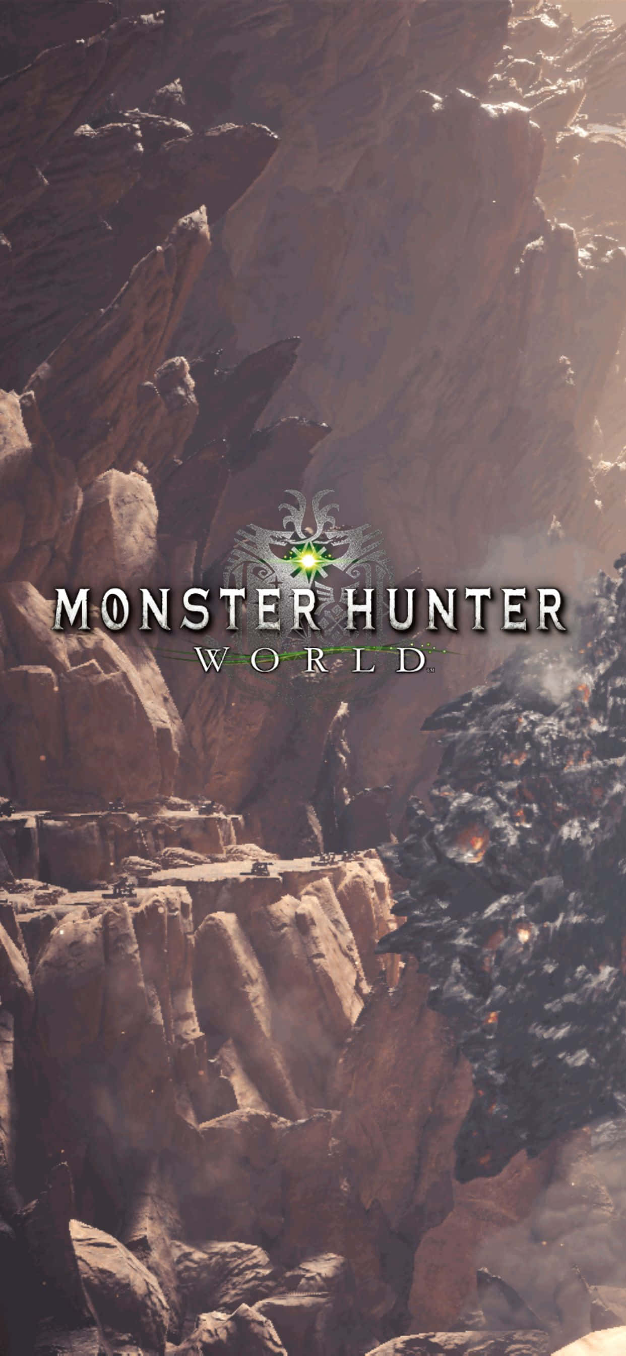 電玩遊戲 桌布 壁紙 — 崎嶇的峽谷景觀，高聳的岩層和Monster Hunter World的發光綠色標誌。