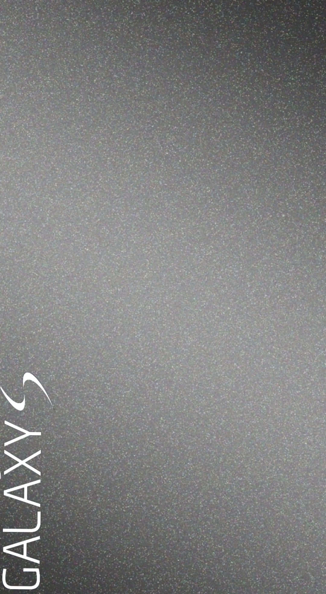 Galaxy S 桌布 壁紙 — 左側帶有垂直「Galaxy S」標誌的極簡深灰色紋理壁紙，帶有細微斑點。