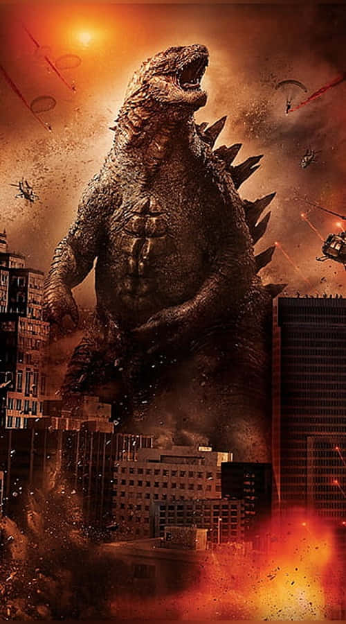 Godzilla Comic 桌布 壁紙 — 巨型哥吉拉在燃燒的城市景觀中咆哮，直升機和降落傘在熾熱的橙色天空下與這隻龐然大物戰鬥。